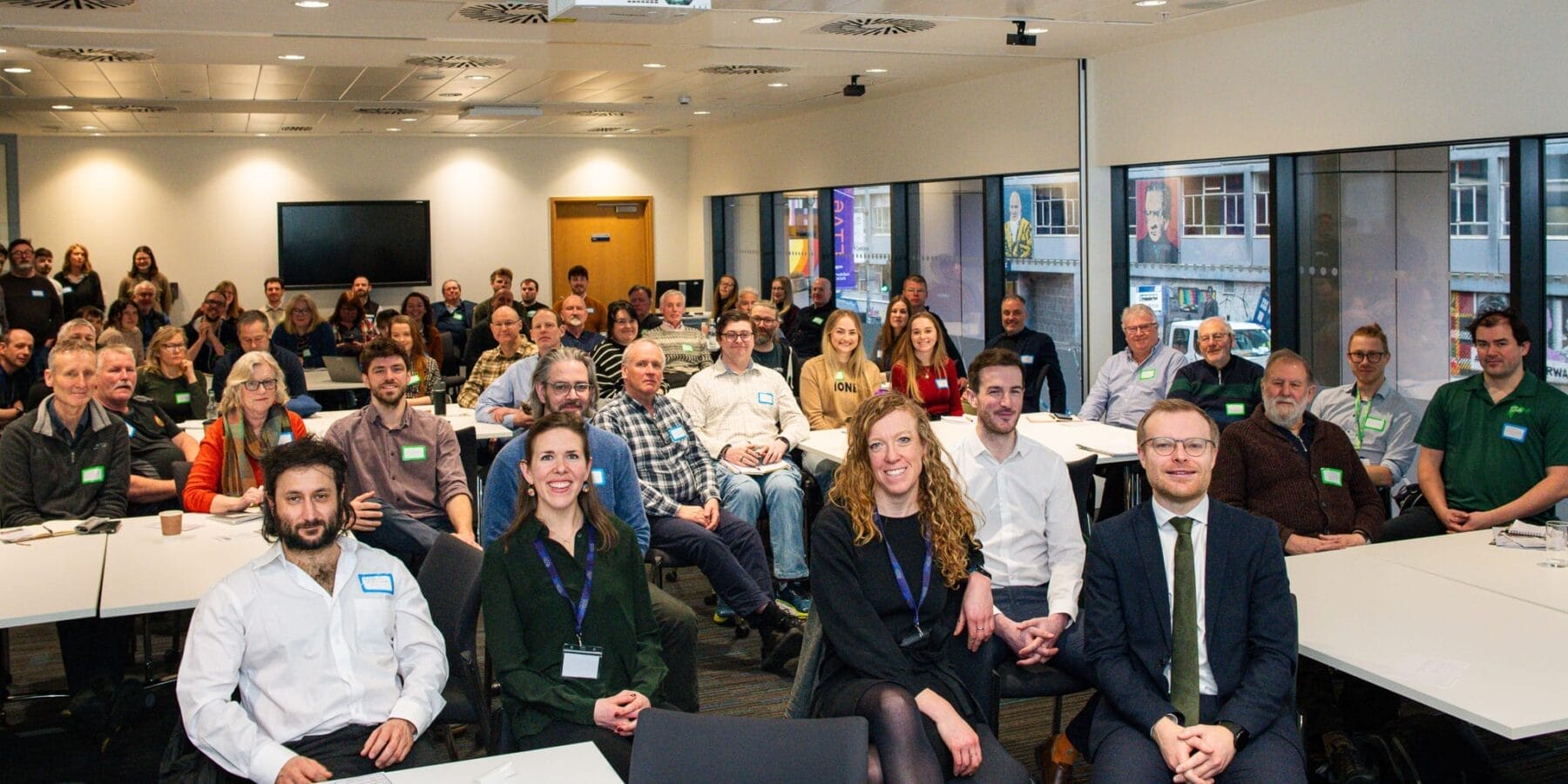 Full meeting room audience with CES members & staff and govt ministers