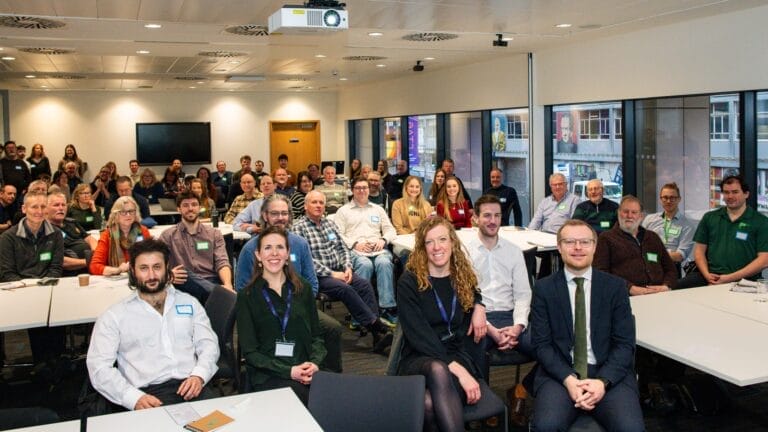 Full meeting room audience with CES members & staff and govt ministers