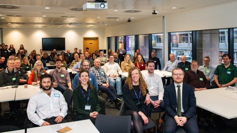 Full meeting room audience with CES members & staff and govt ministers