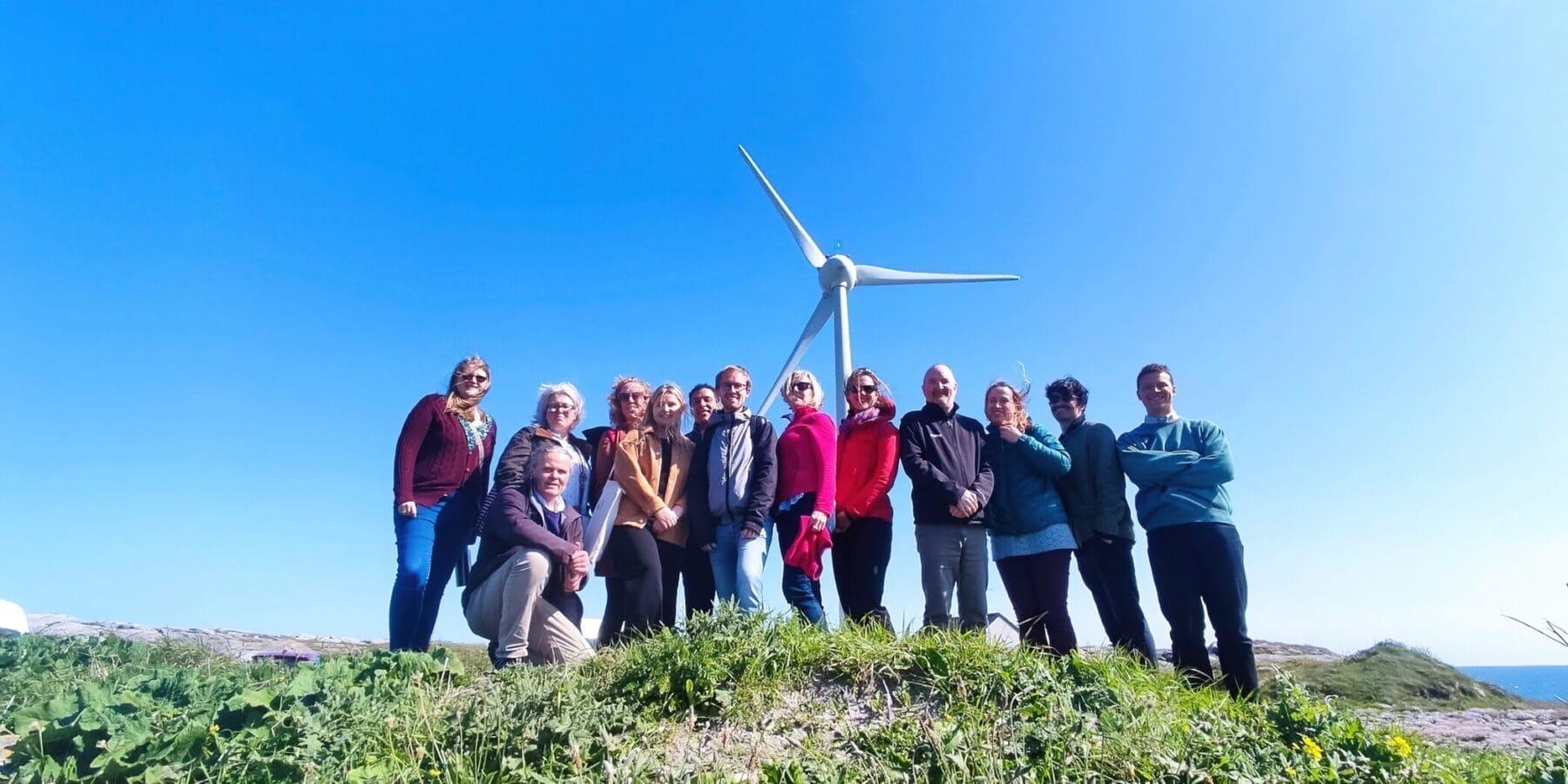 CES members in front of a community wind turbine