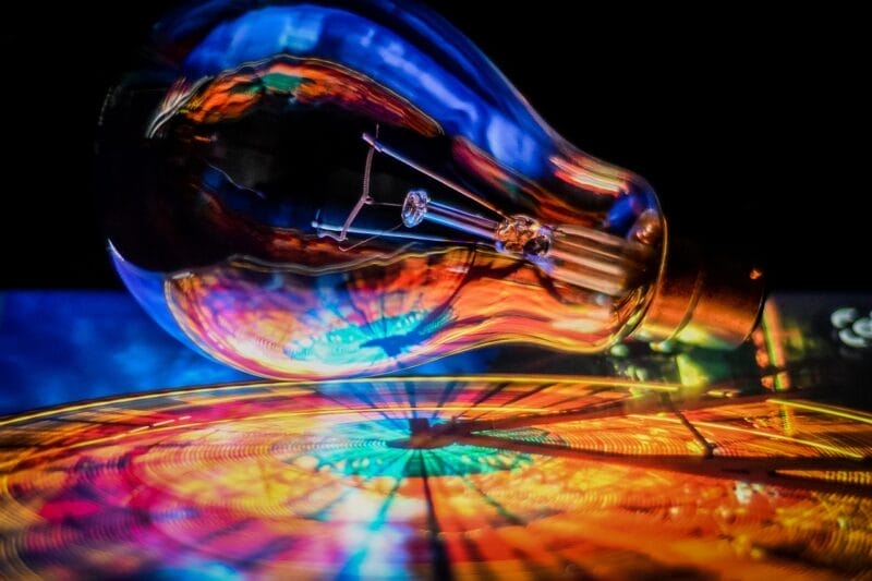 Light bulb above reflective surface